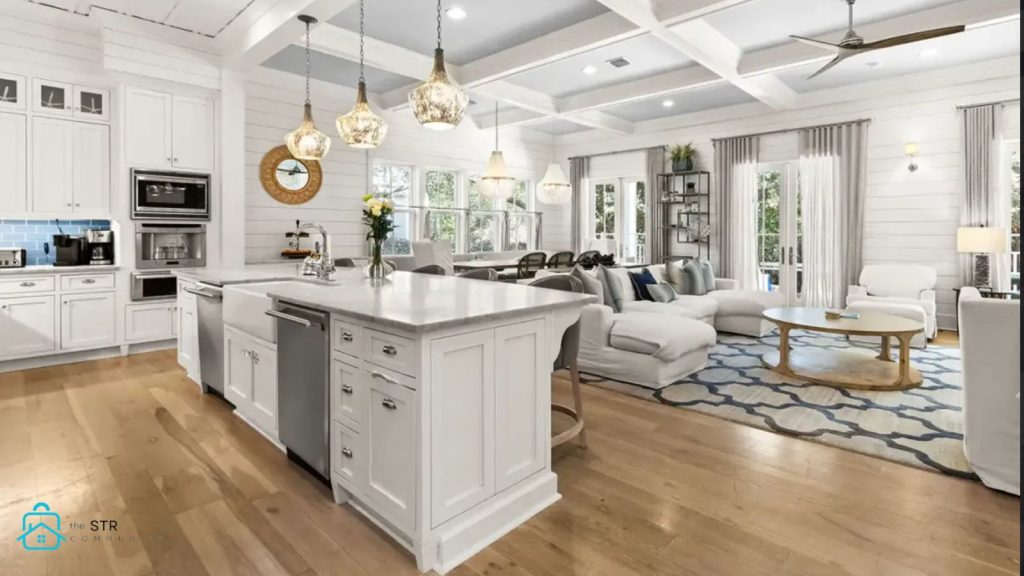 Bright, well-designed short-term rental living room and kitchen with open layout, natural light, and modern furnishings